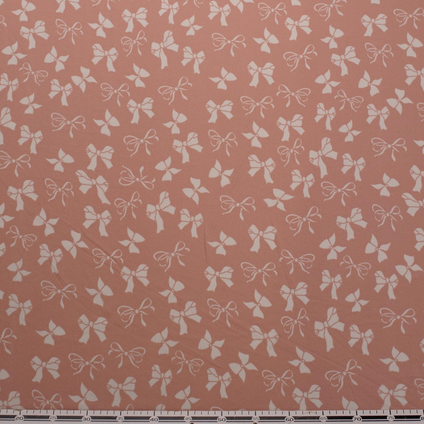 CREPE BOUCLE ESTAMPADO ROSA APRICOT MOÑOS