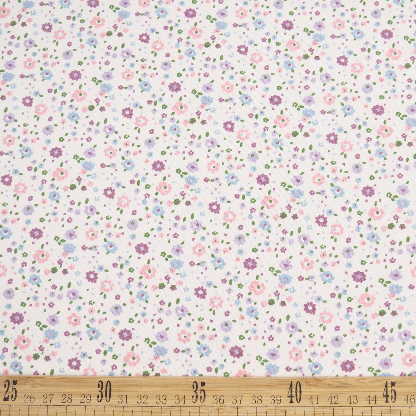 INTERLOCK COTTON INFANTIL BLANCO BRILLANTE CON PEQUEÑAS FLORES