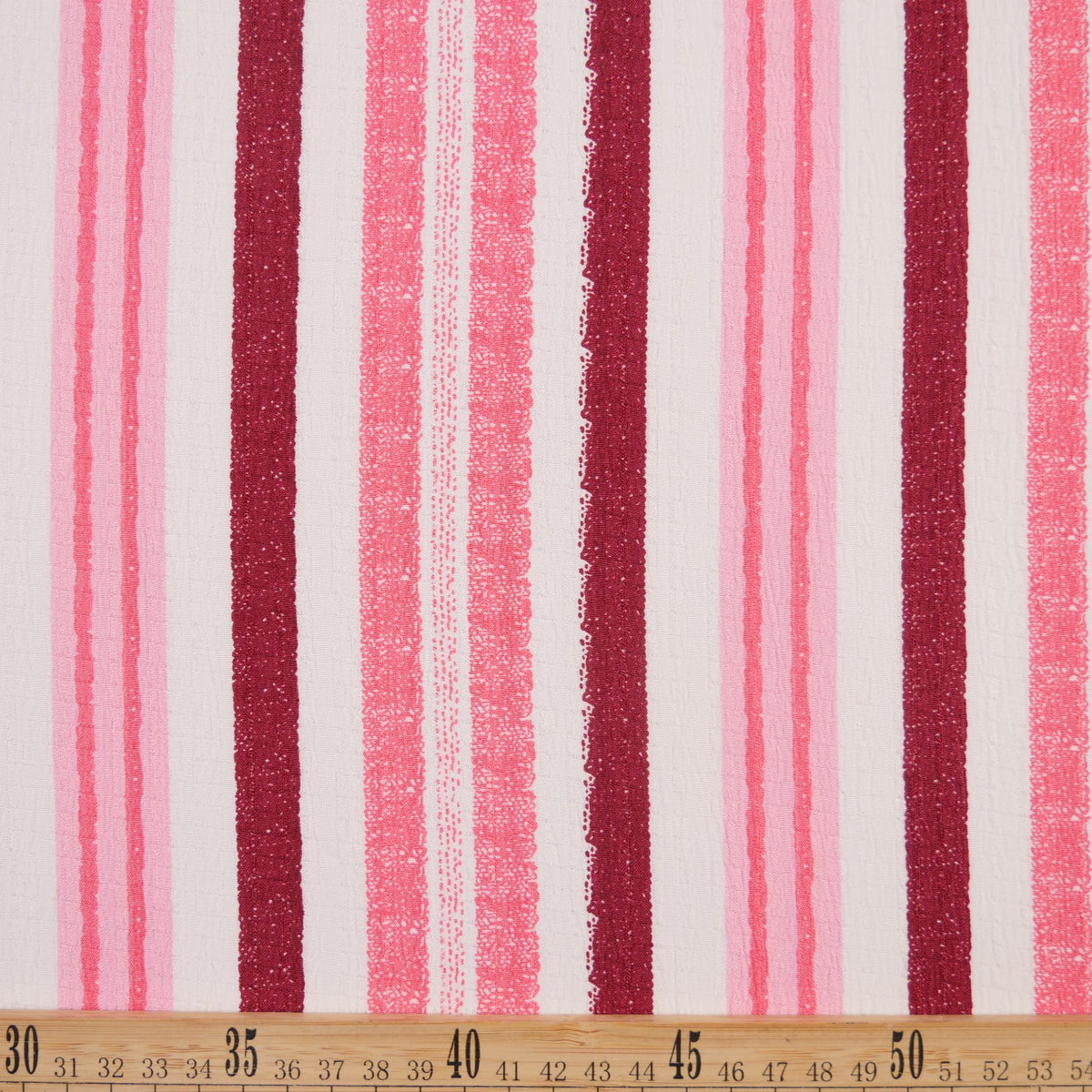 CREPE MARINA ESTAMPADO ROSA METAL RAYAS