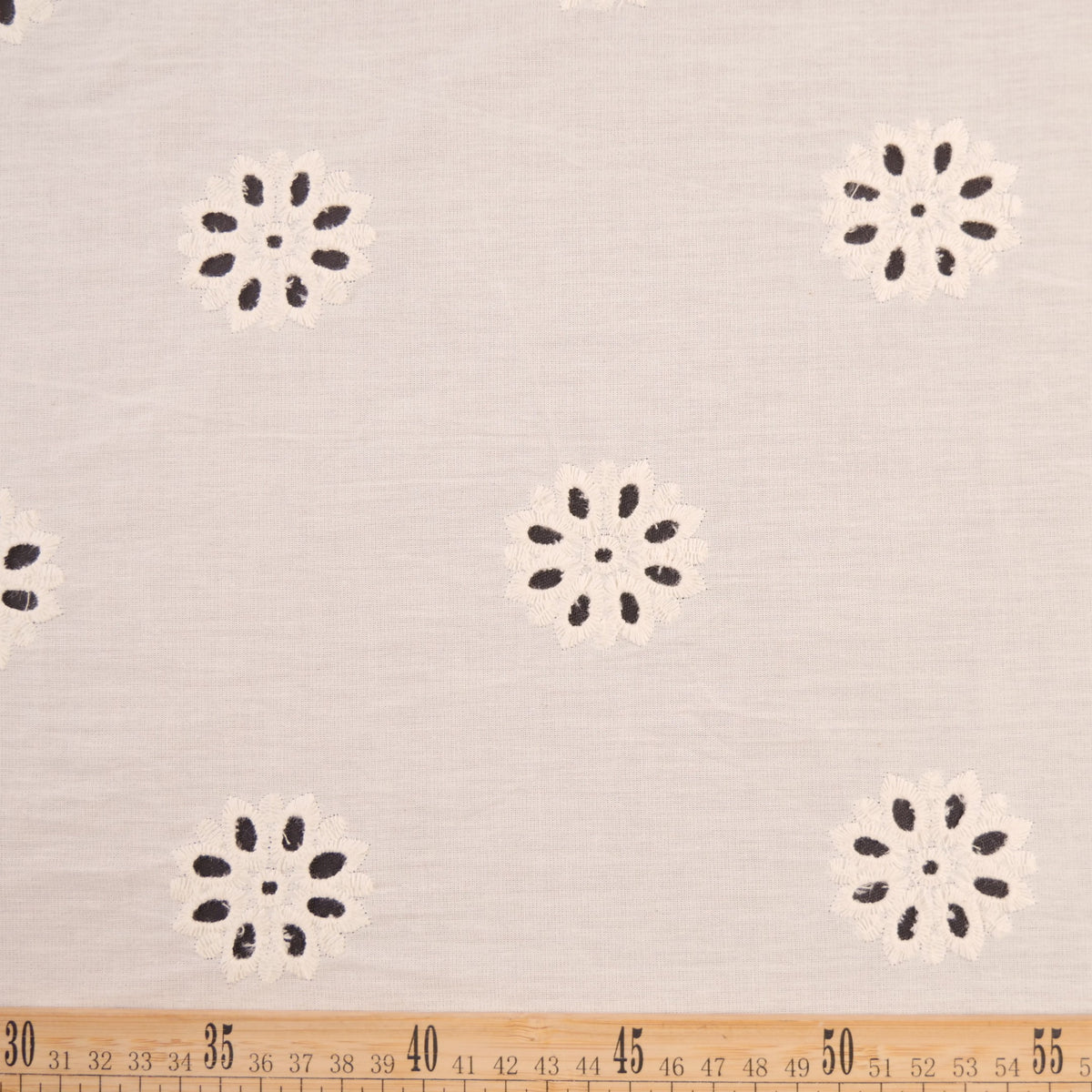 BRODERIE LOLA BLANCO BRILLANTE CON FLORES MARGARITAS