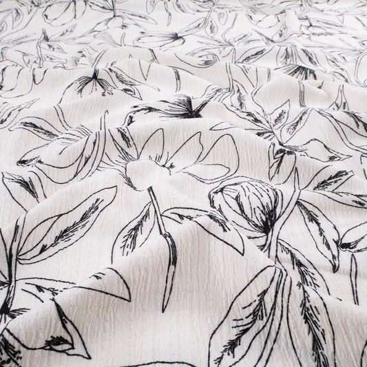 CREPE MARINA ESTAMPADO BLANCO ESTRELLA FLORAL EN LINEAS NEGRAS