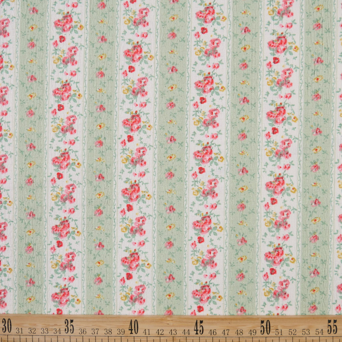 CREPE MARINA ESTAMPADO BLANCO BRILLANTE FLORAL CON RAYAS VERDES