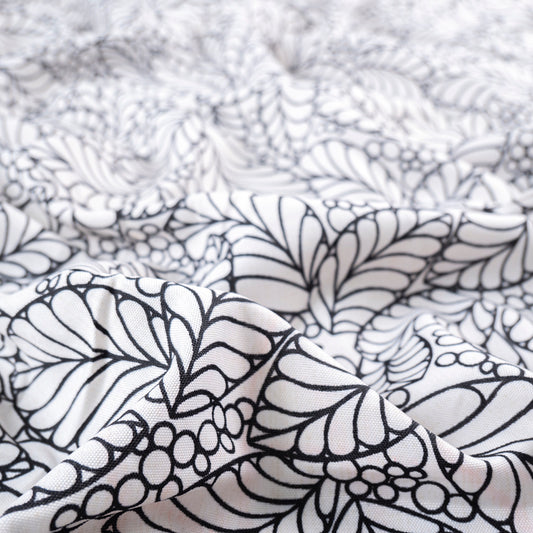 MANTELERIA ESTAMPADO BLANCO PAPIRO HOJAS EN LINEAS NEGRAS