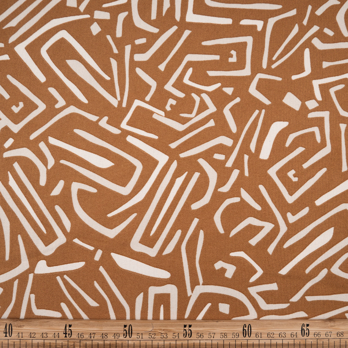 MANTELERIA ESTAMPADA CAMEL TAN RAYAS