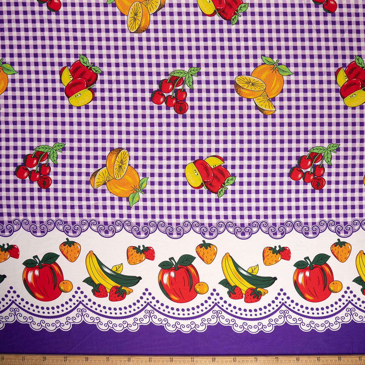 MANTELERIA ESTAMPADA VIOLETA AFRICA CUADRILLÉ CON FRUTAS