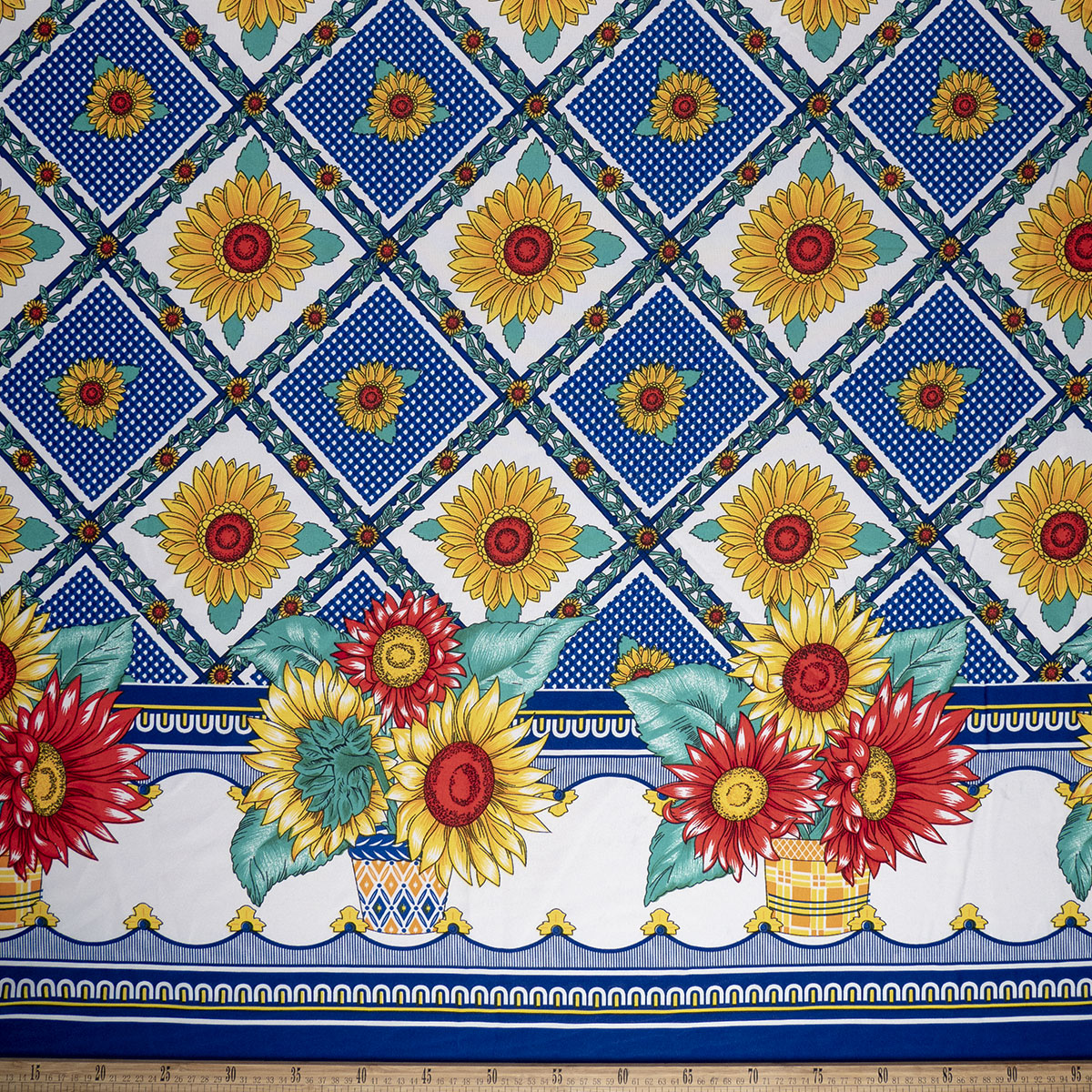 MANTELERIA ESTAMPADA AZUL SURF GUARDAS CON GIRASOLES