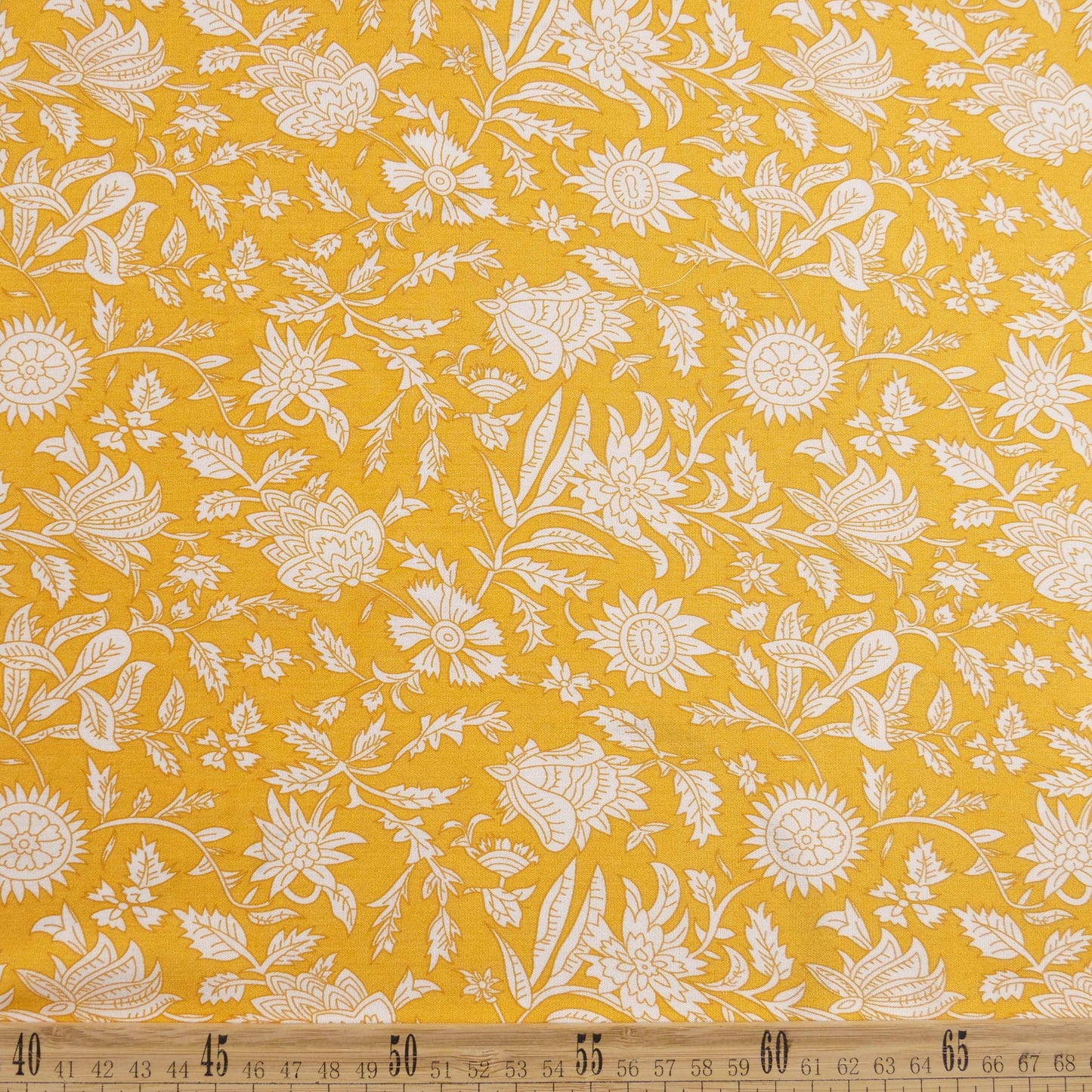 FIBRANA ESTAMPADA AMARILLO ACEITE CON FLORES BLANCAS