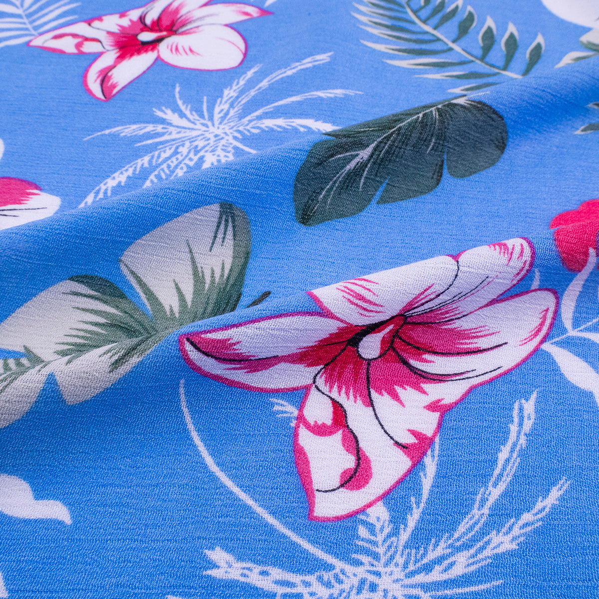 FIBRANA CREPE ESTAMPADA AZUL VISTA FLORAL DE HIBISCO Y HOJAS